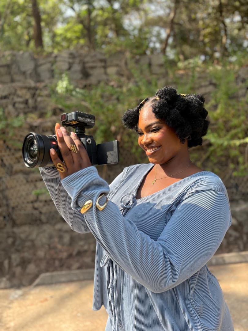 Amara filming with camera