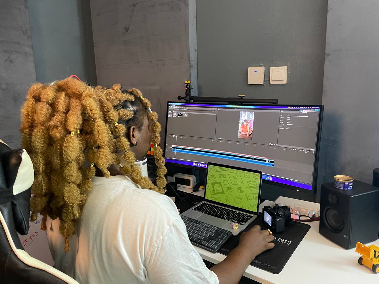 Amara editing at her desk